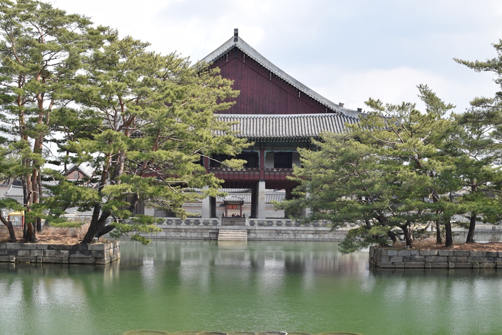 a building with a pond in front of it