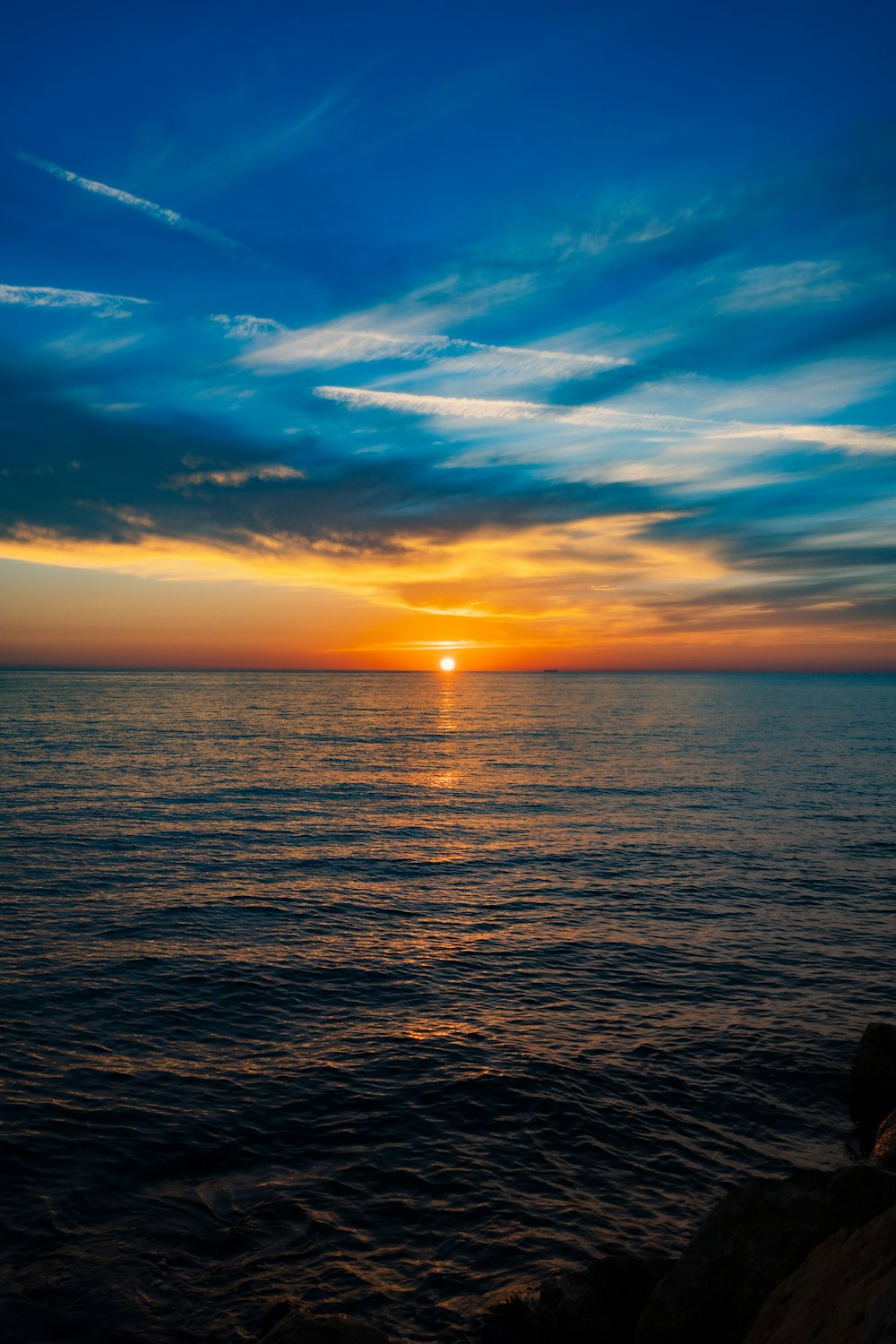 a sunset over a body of water