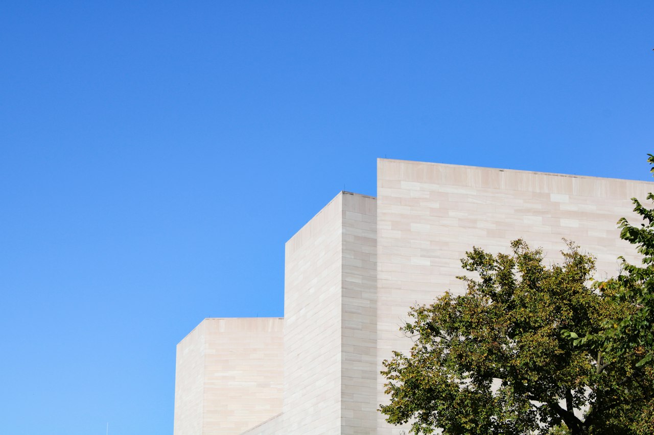 Contemporary limestone and glass hillside home in Austin, Texas, illustrating what it costs to buy in Barton Hills in 2026.