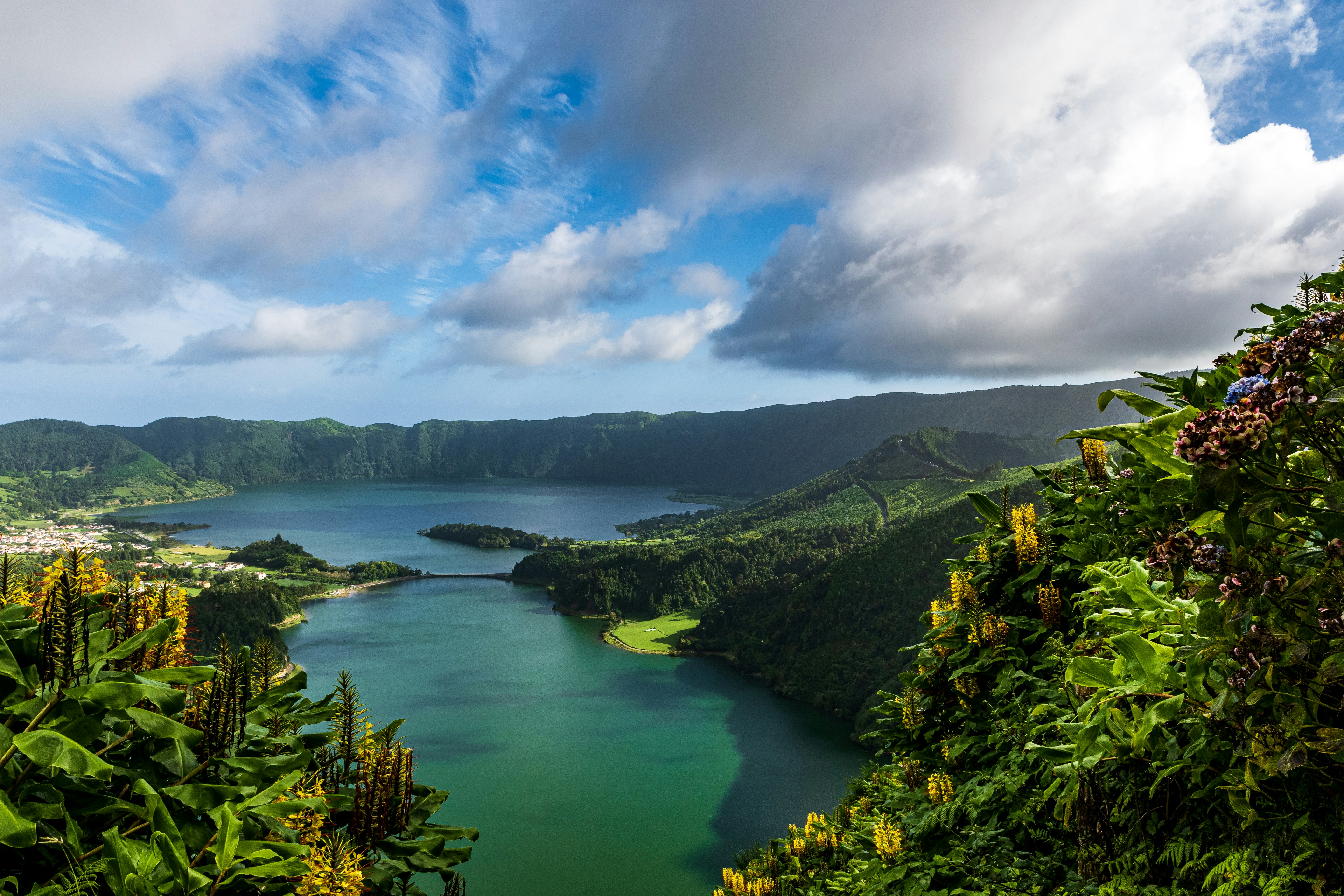a body of water surrounded by hills