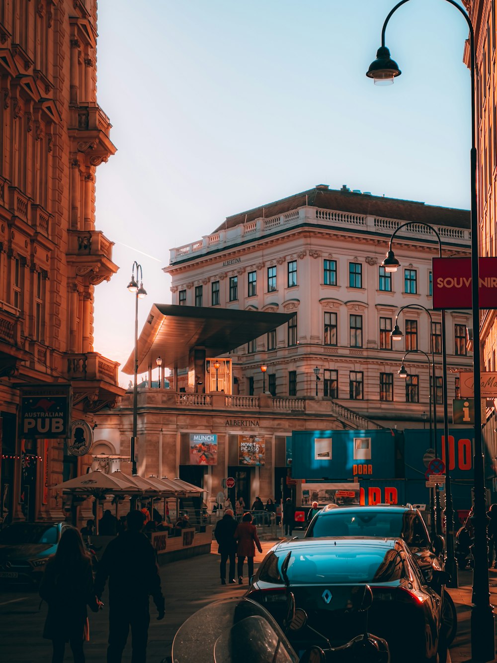 a street with cars and people