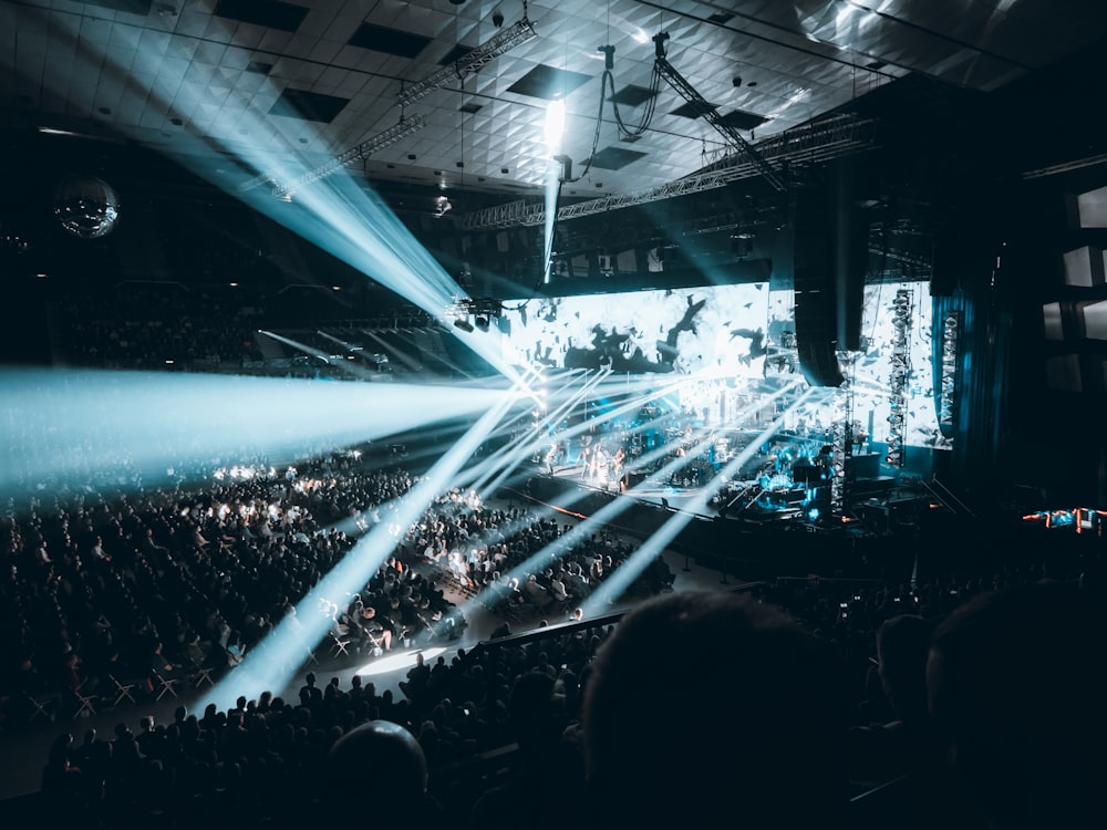 a large crowd of people in a concert hall