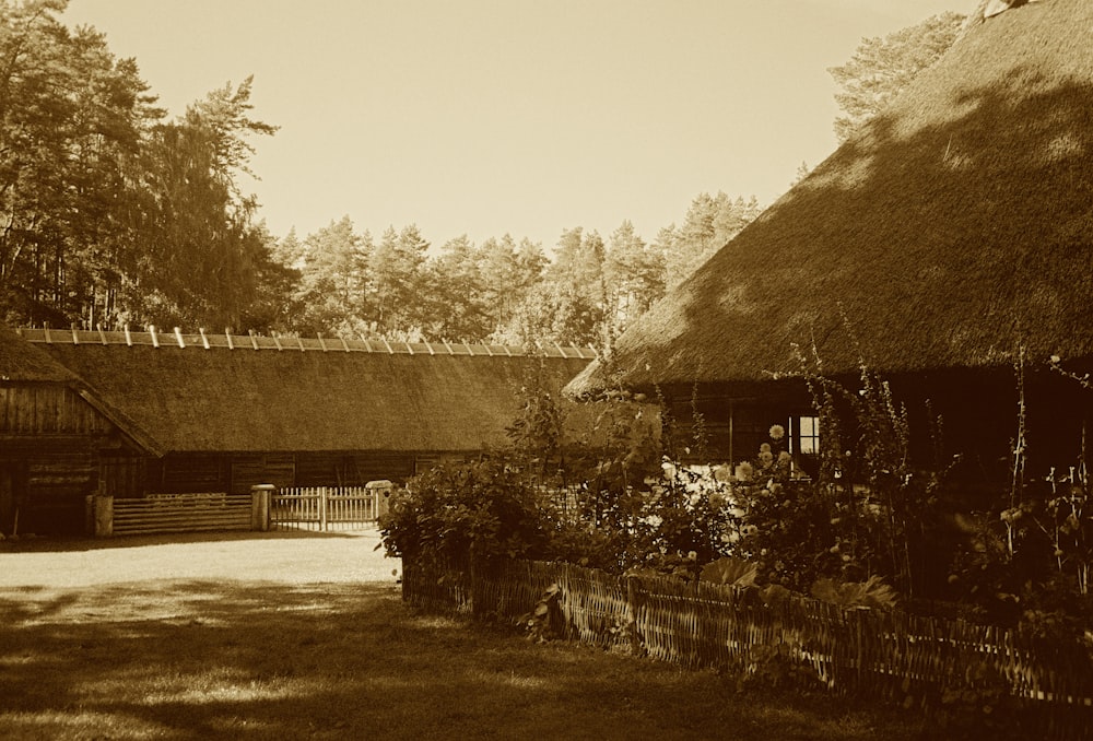 a house with a fence and trees