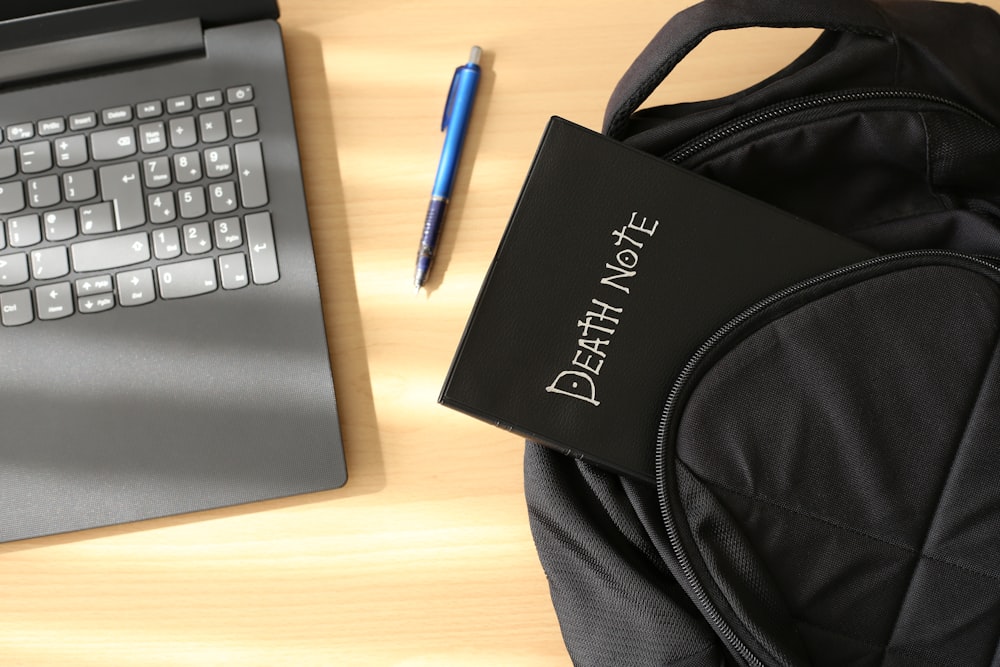 a bag and a laptop on a table