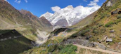 Scenic mountain trail near the hotel with pilgrims walking towards Kedarnath in the early morning mist.