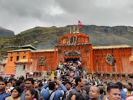 The temple courtyard during a vibrant festival with marigold decorations.