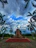 A close-up of the Voortrekker Monument with dramatic clouds overhead.