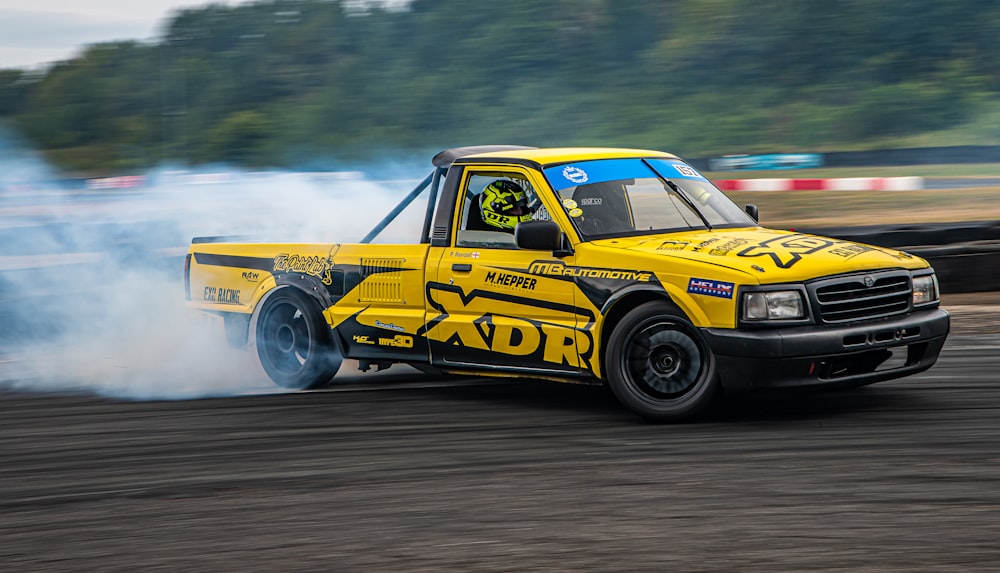 a yellow race car on a track