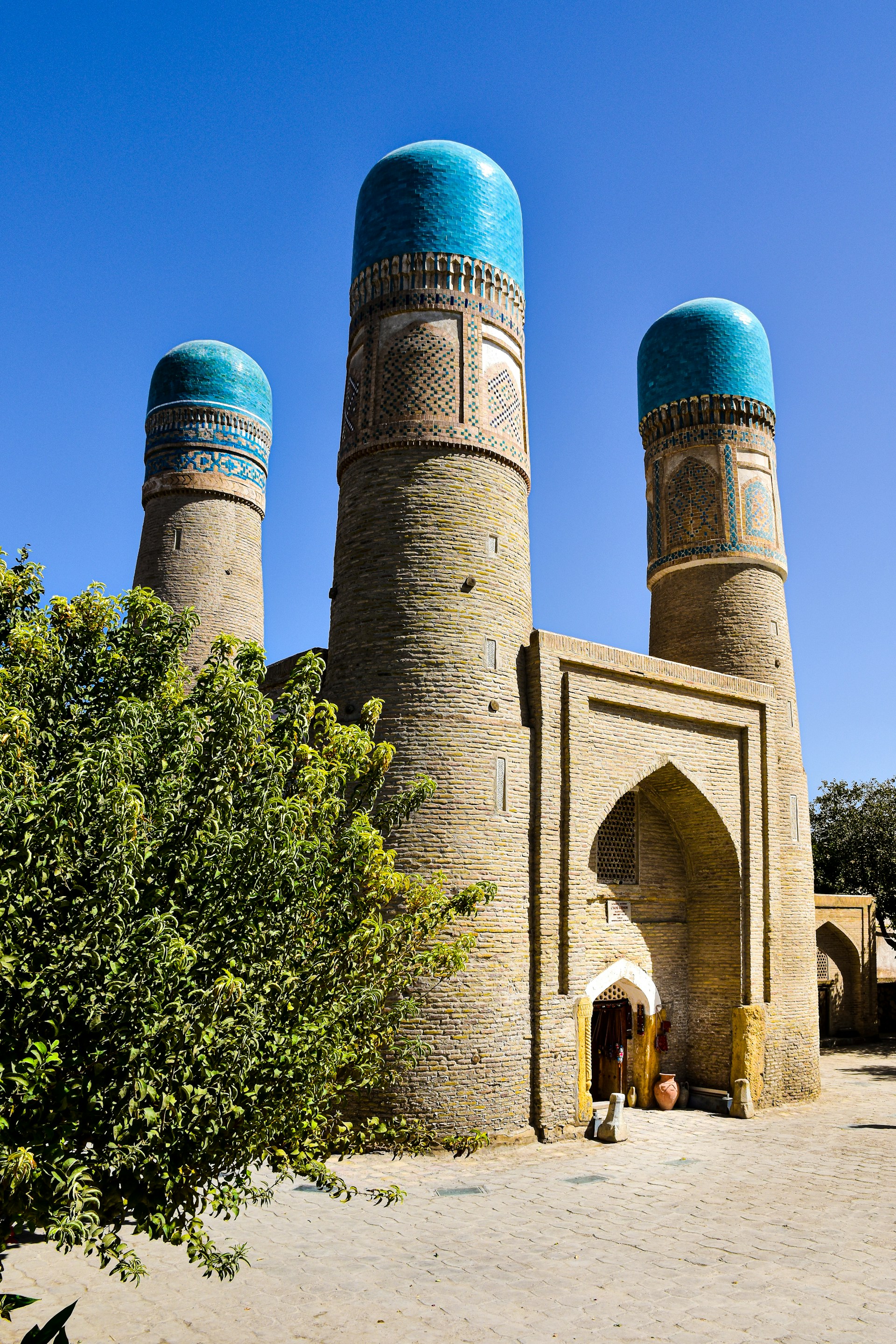a brick building with a blue dome