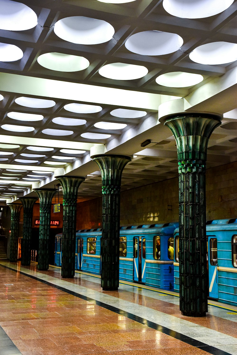 a large room with columns and a large pillar