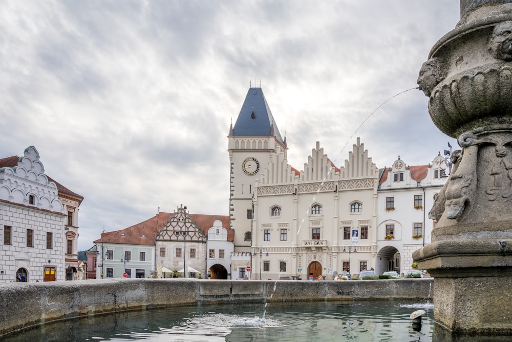 a large white building with a clock tower