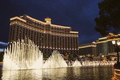 a large building with a fountain in front of it with Bellagio in the background