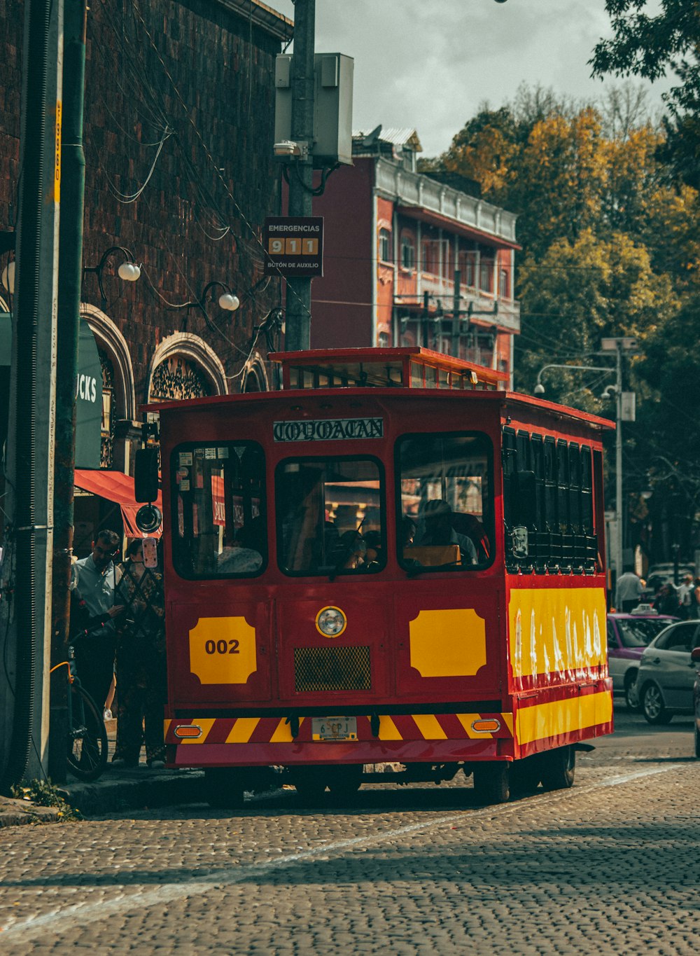 a red trolley on the street