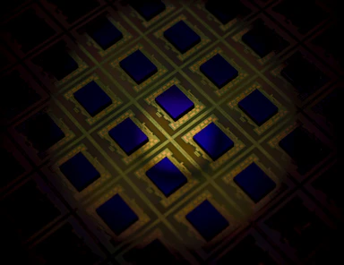 Macro view of a silicon wafer with a grid of chip dies