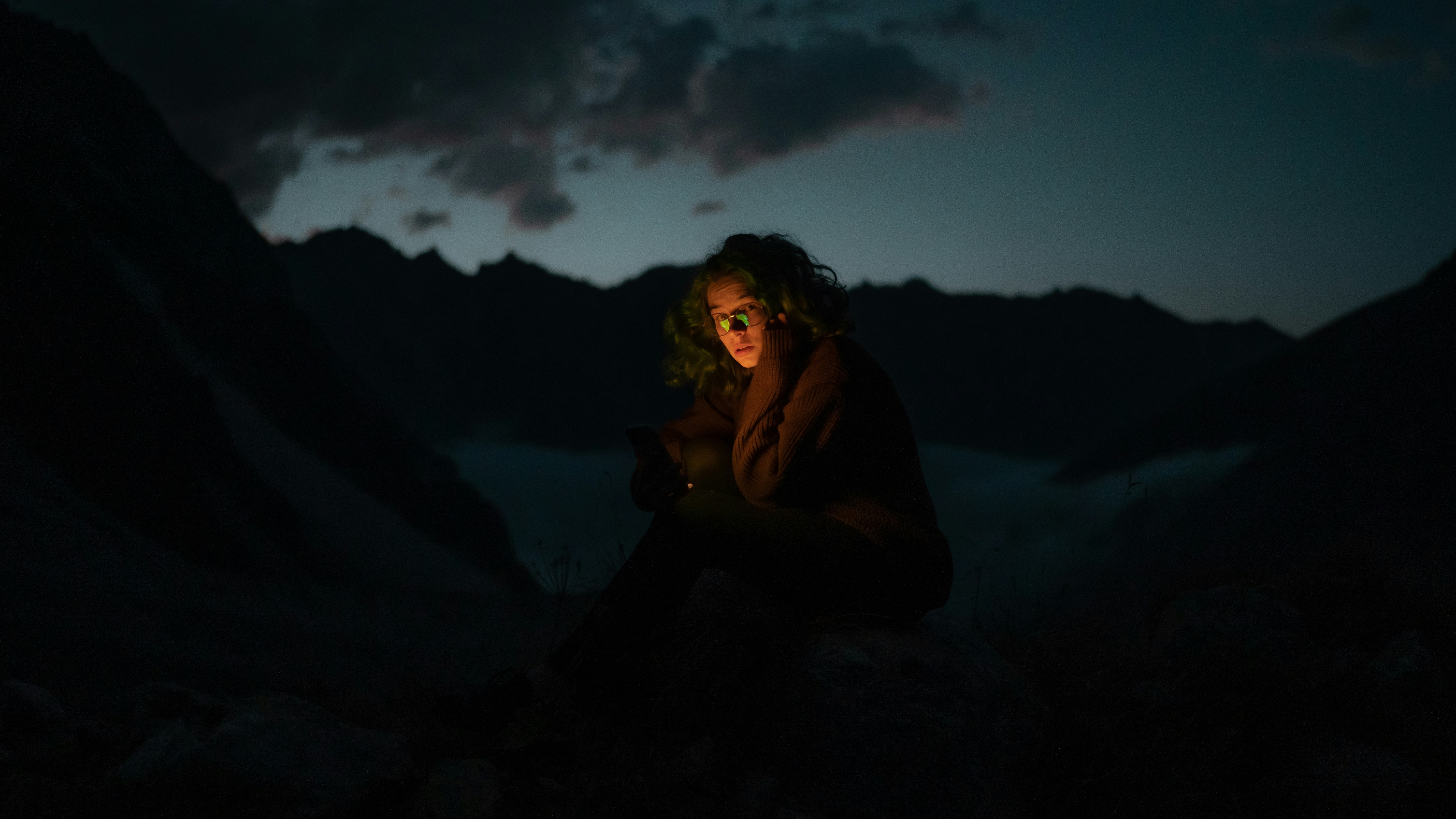 a man sitting in a cave