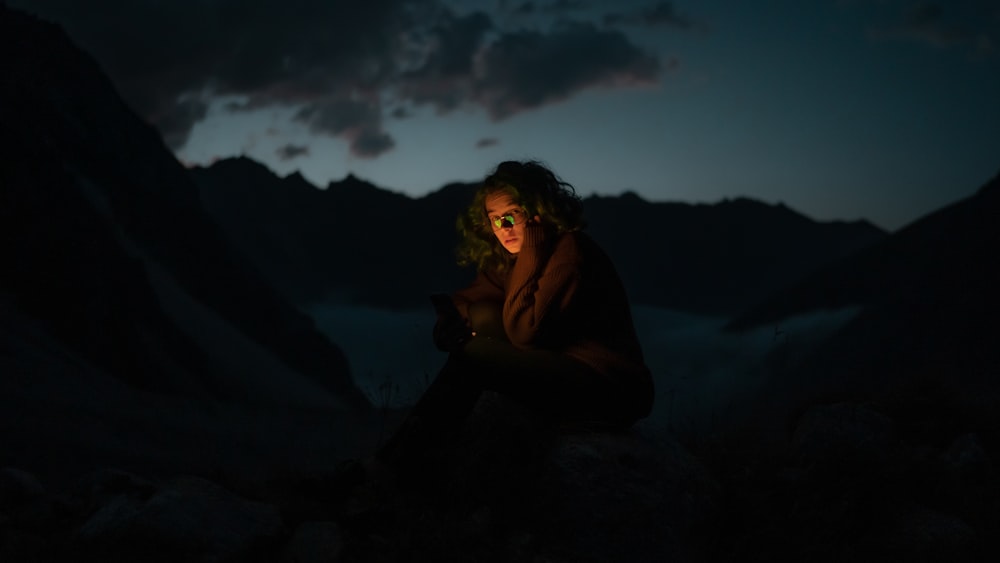 a man sitting in a cave