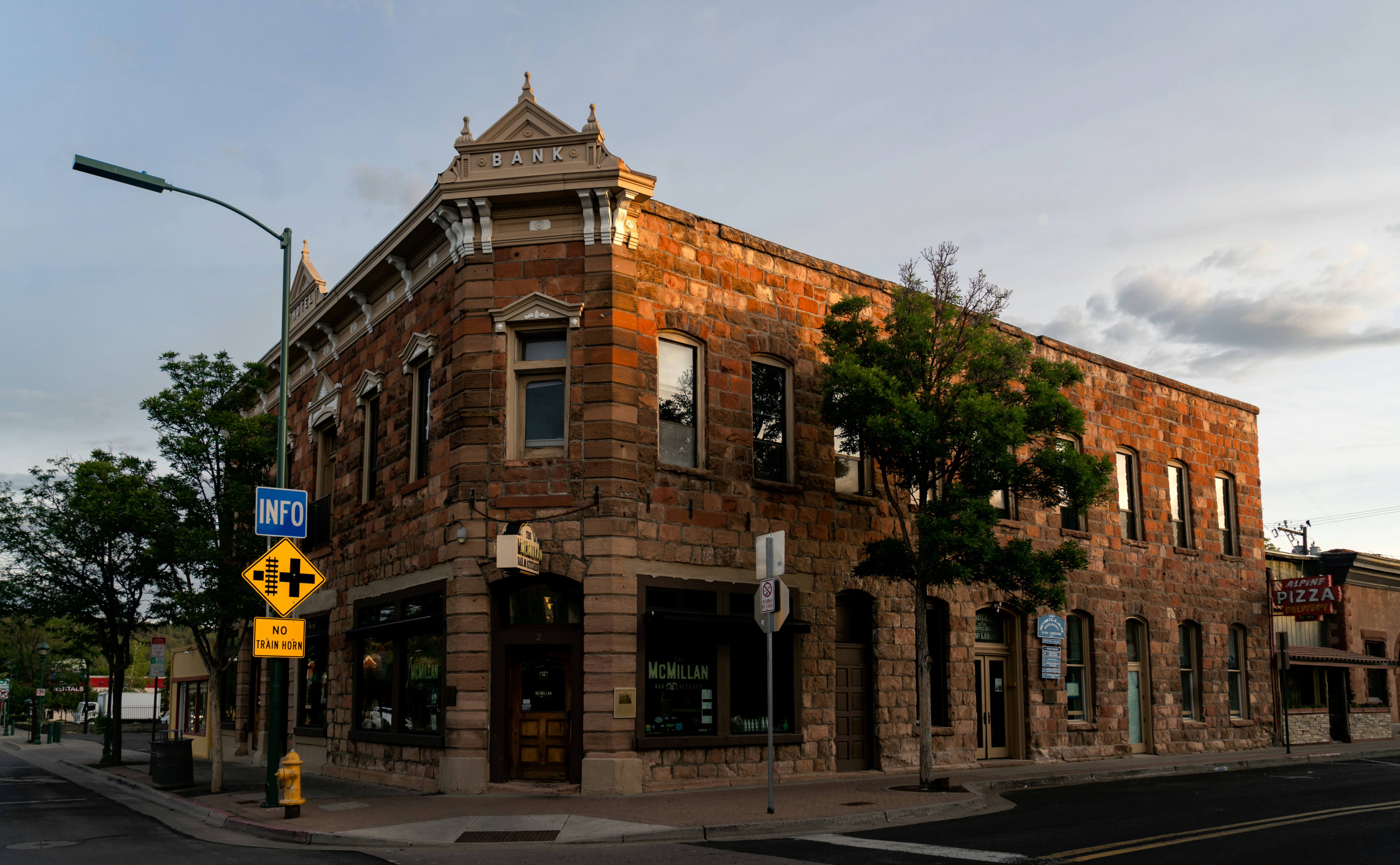 a brick building on a street corner