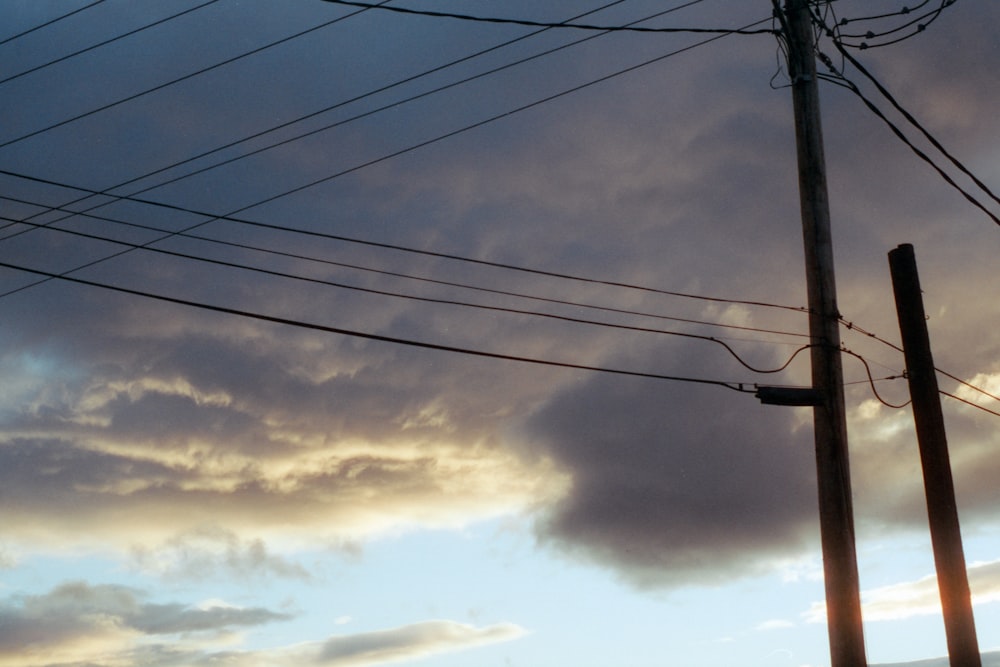 power lines with a blue sky and clouds