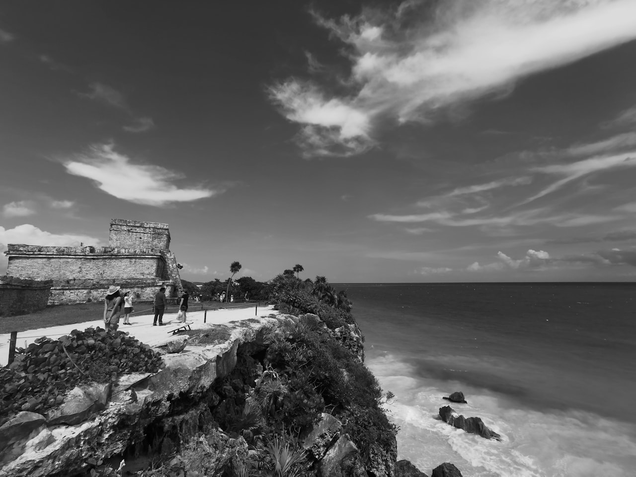 people walking on a path by the water playa forum