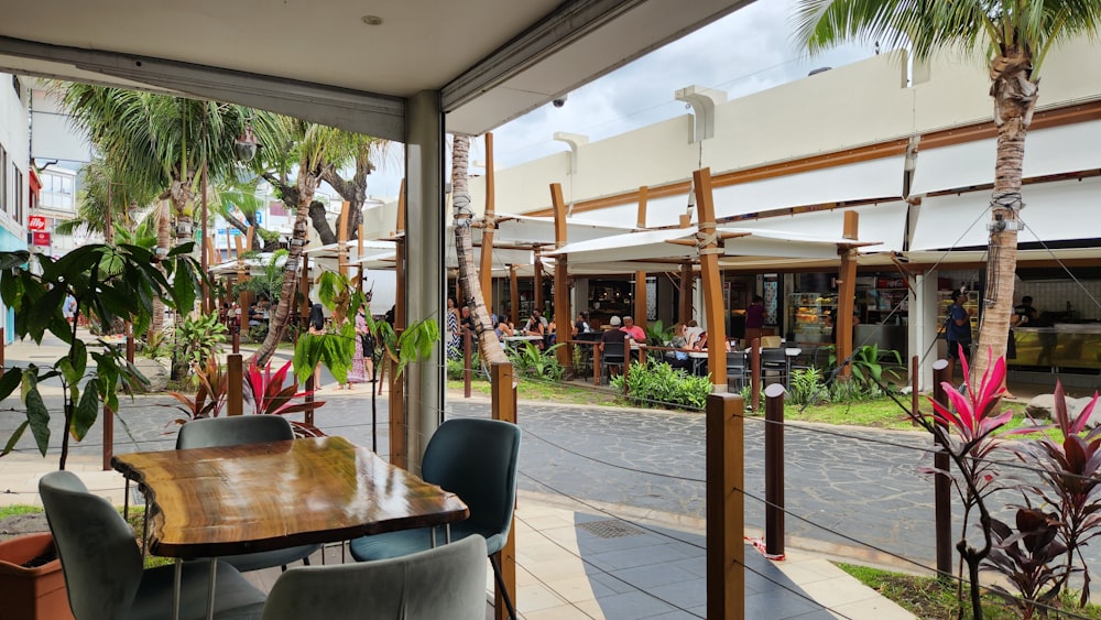 a patio with tables and chairs