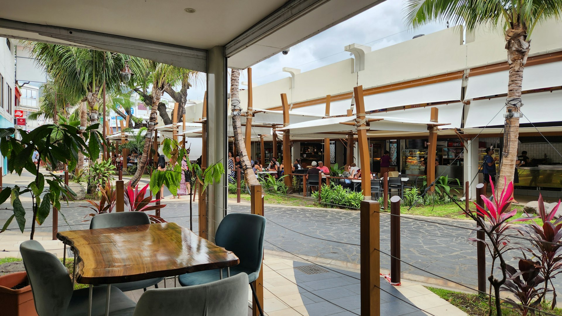 Sunny terrace with tables and chairs illustrating Tahiti climate