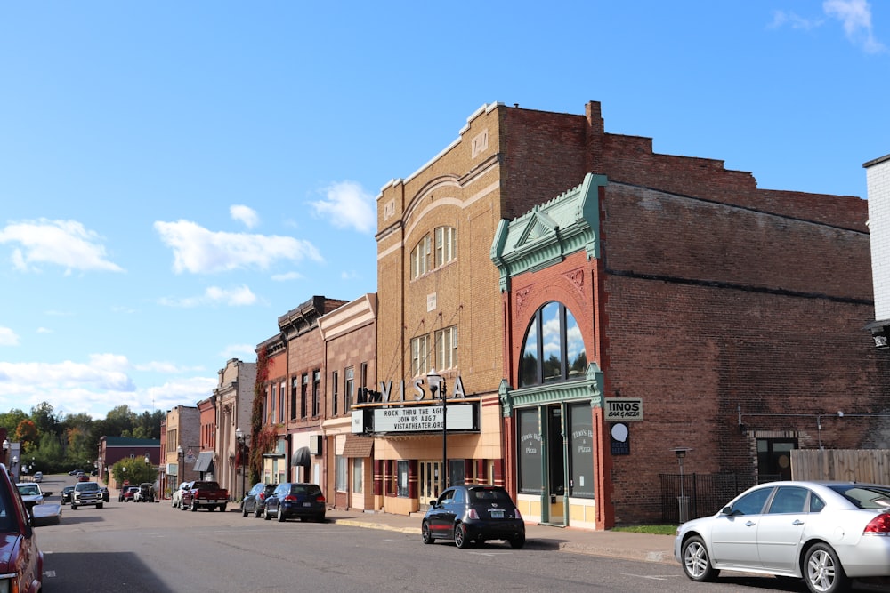 a street with cars and buildings along it