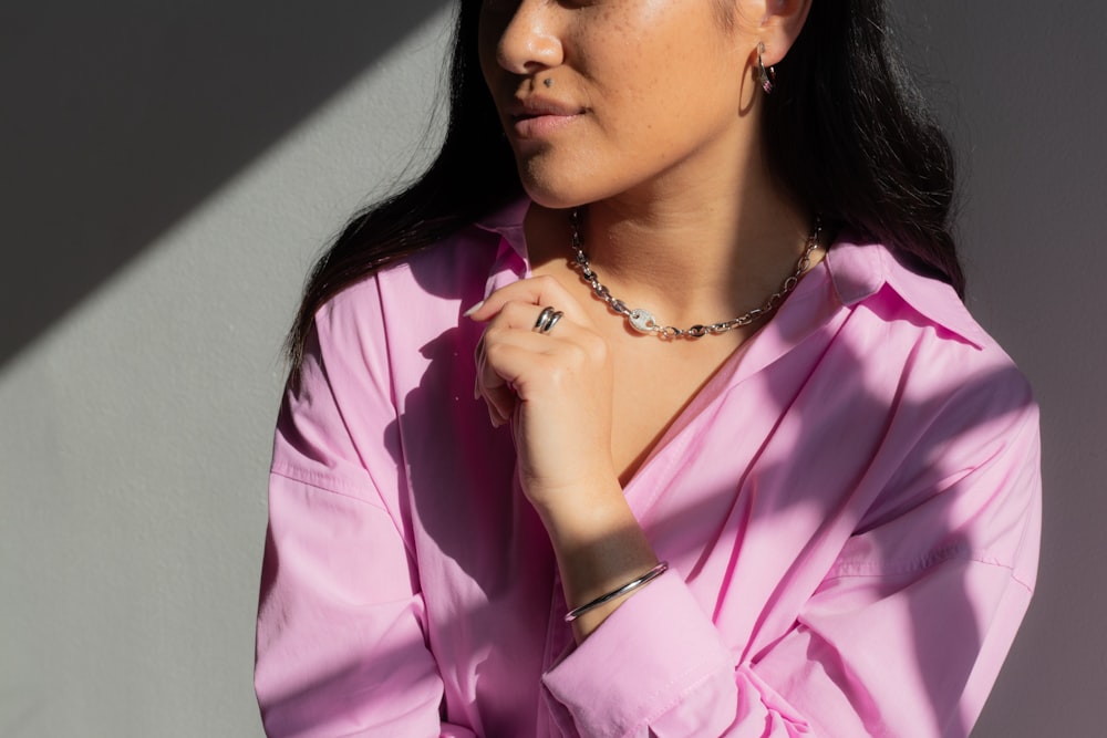 a woman wearing a pink shirt