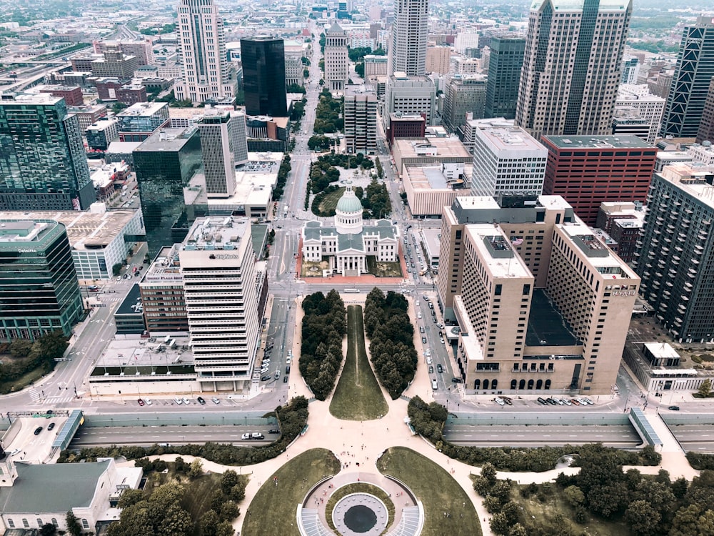 a city with a fountain and buildings