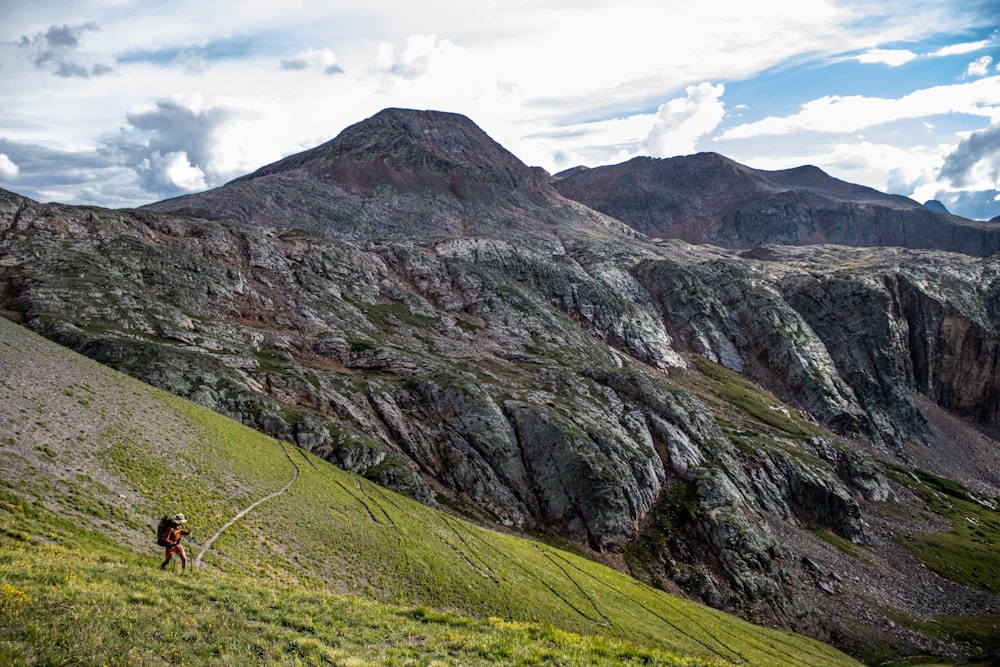 a person hiking up a mountain