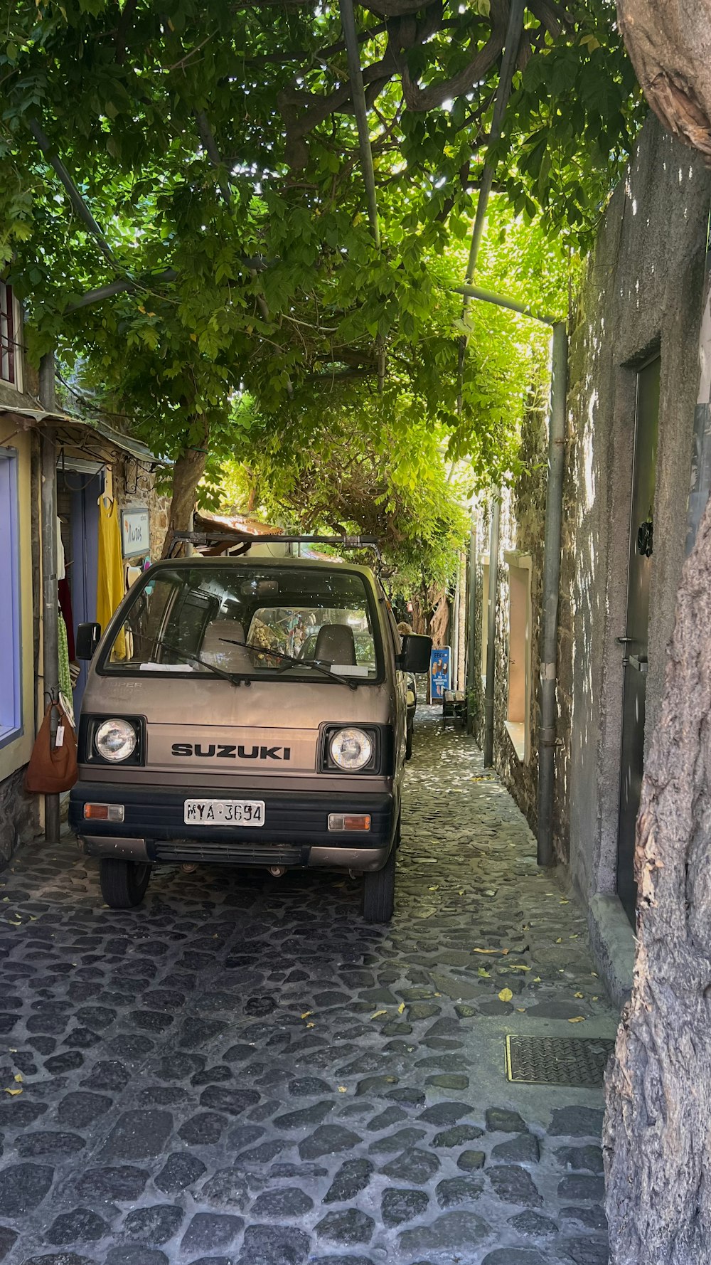 a car parked on a cobblestone street