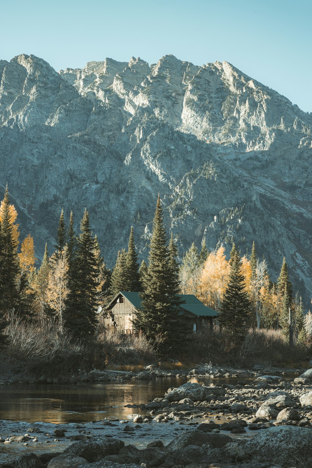 a house in front of a mountain