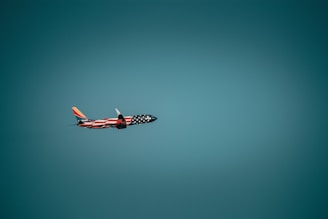 a small airplane flying in the sky