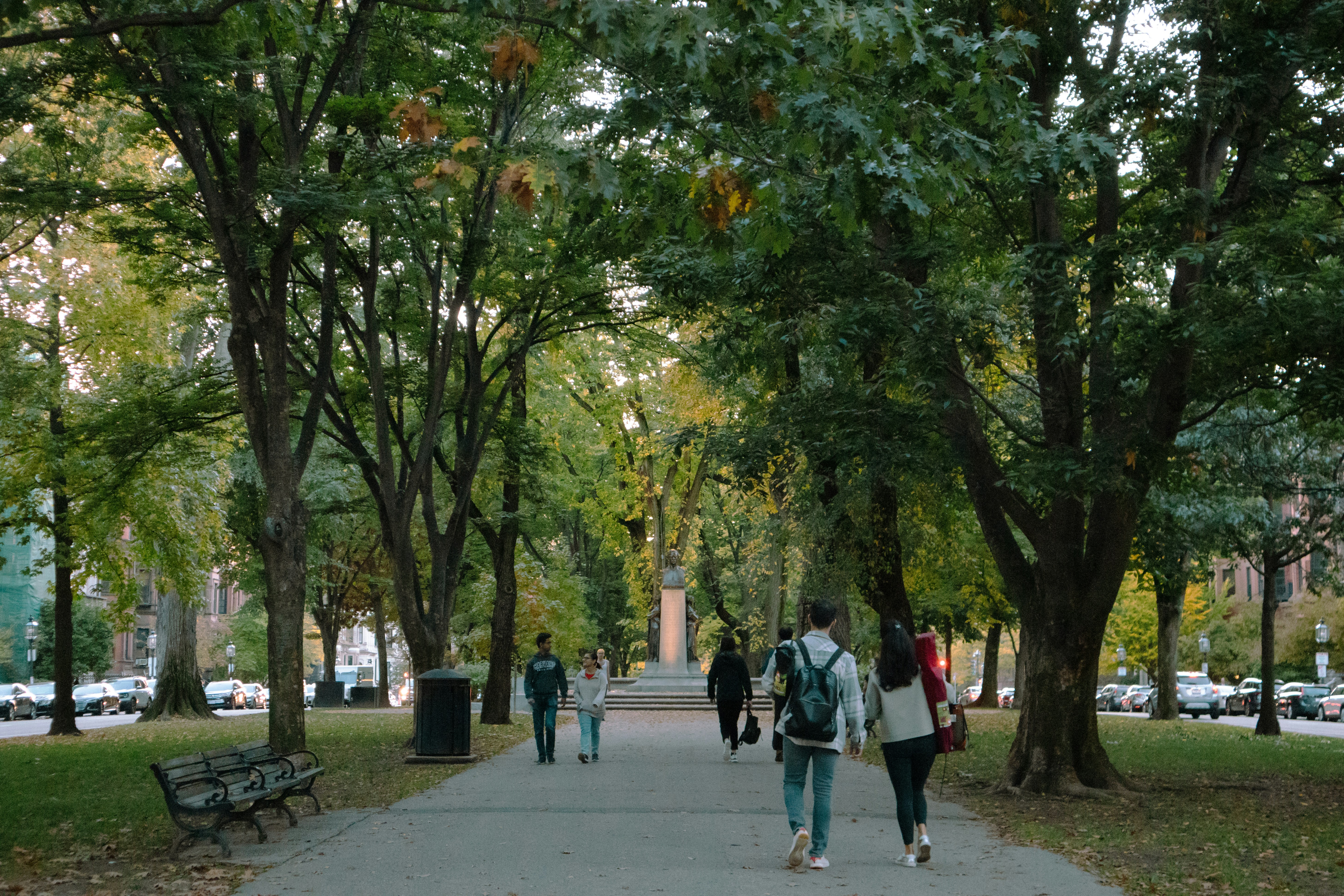 people walking on a sidewalk