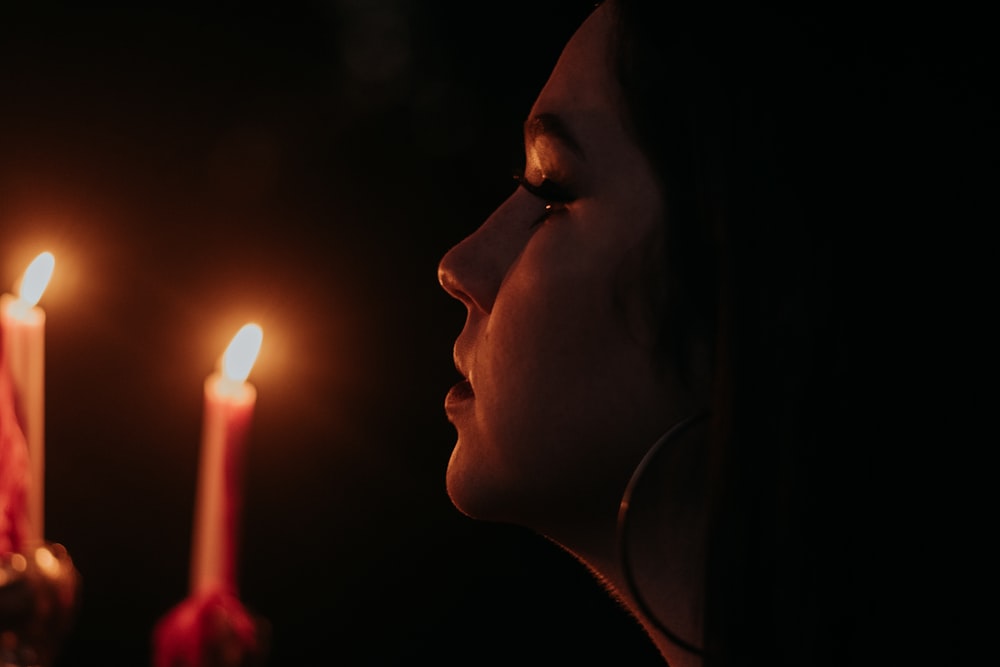 a man blowing out candles