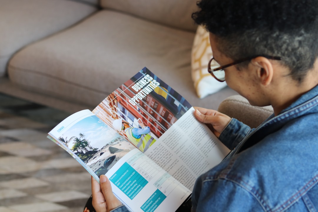 a man reading a book,