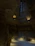Warmly lit cave room with rustic stone walls and soft bedding inviting relaxation.