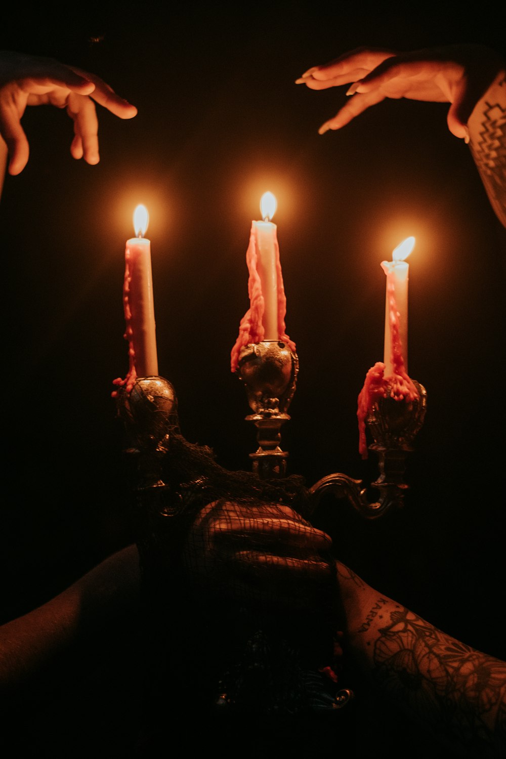 a group of people holding candles