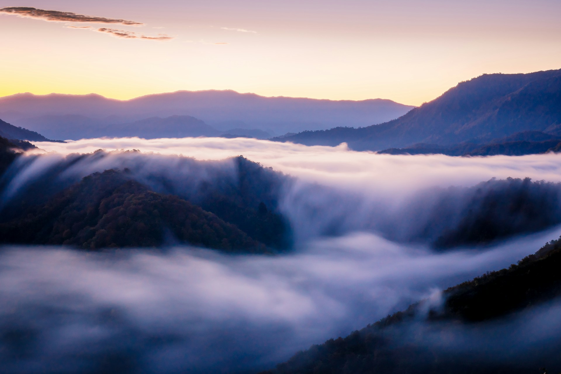 a view of the clouds and mountains