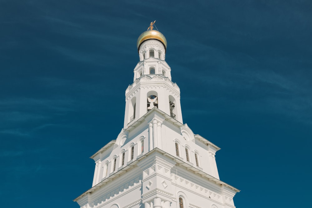 a white building with a gold domed roof