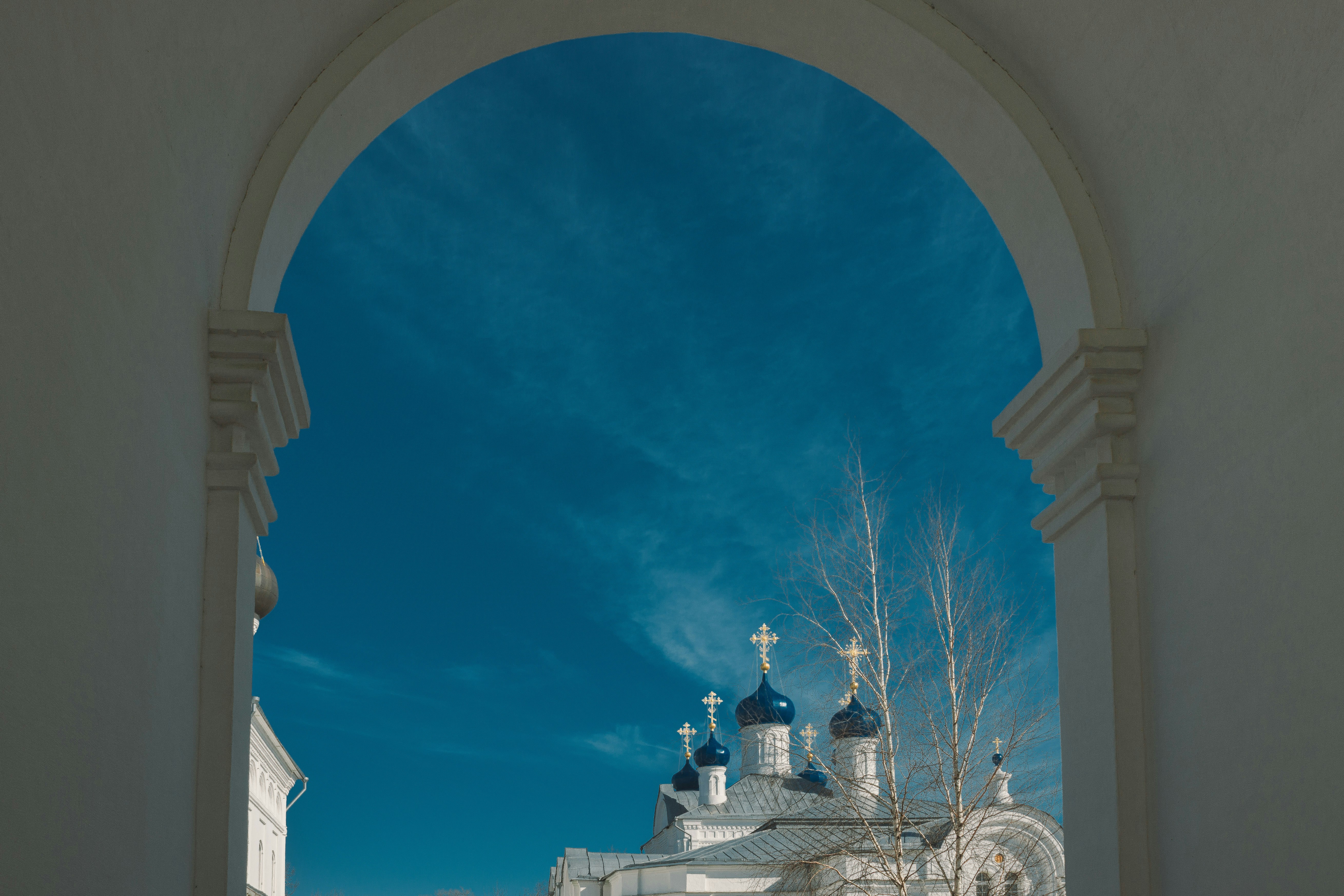 A view of a building through a window photo – Free Building Image on ...