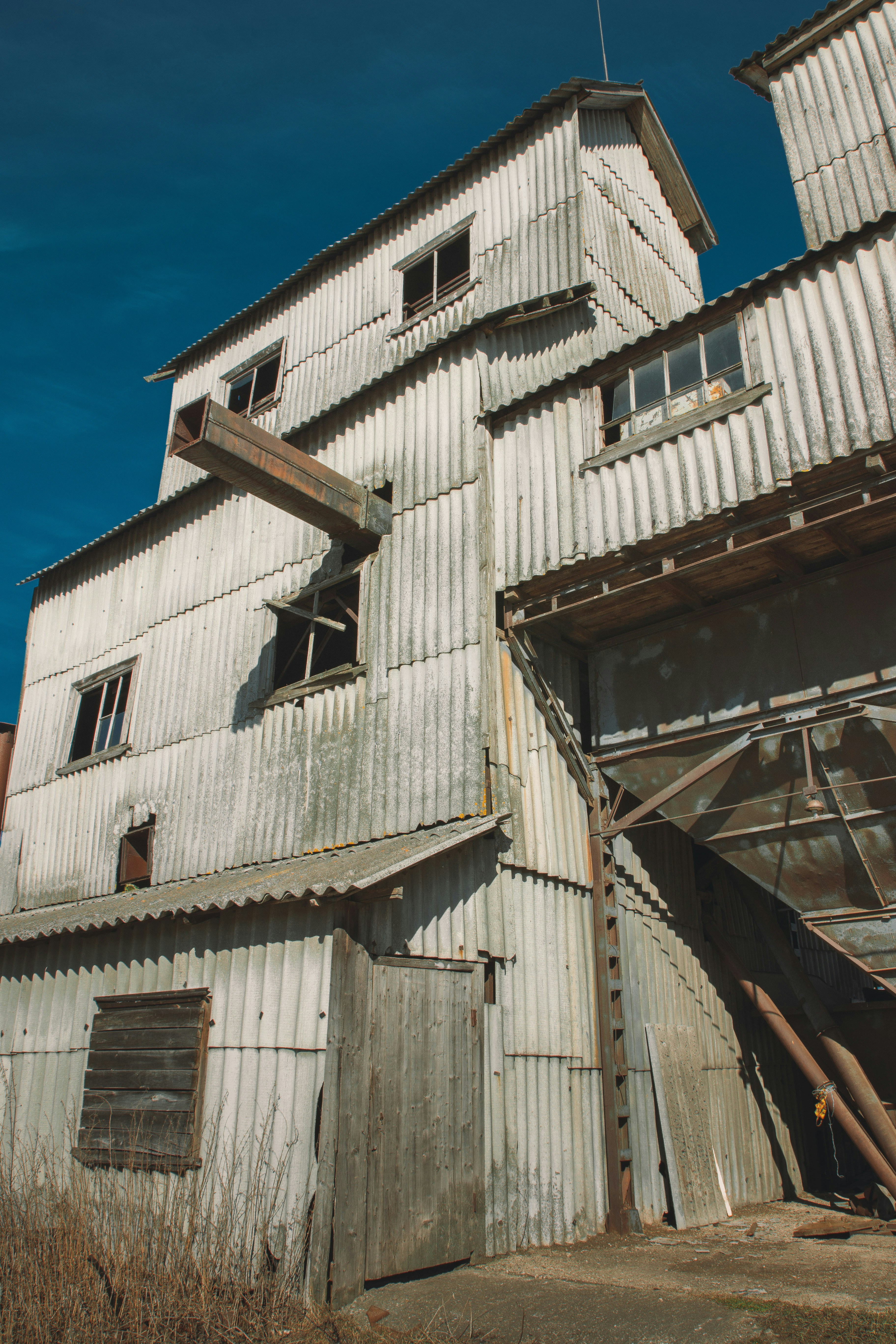 a white building with broken windows