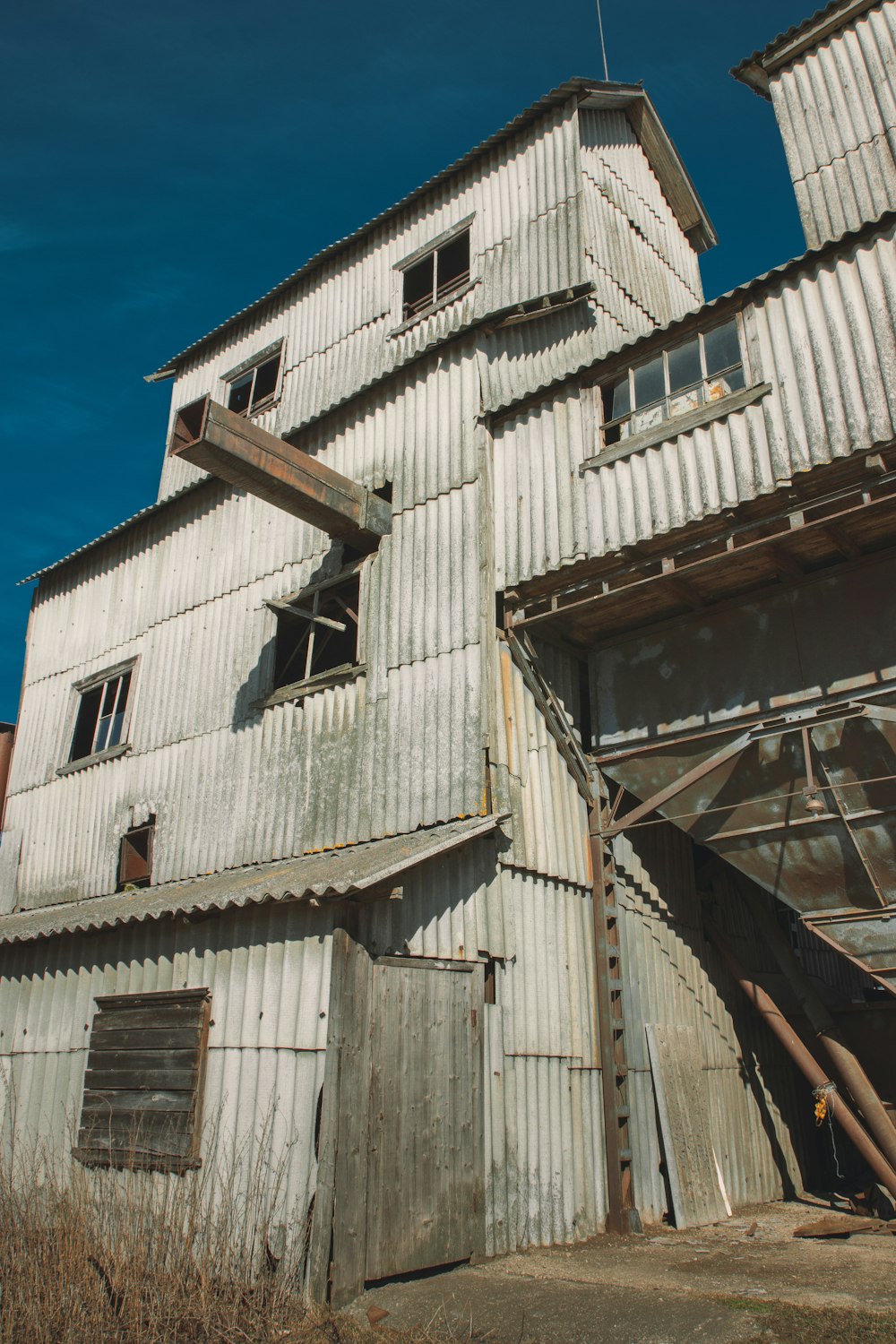 a white building with broken windows