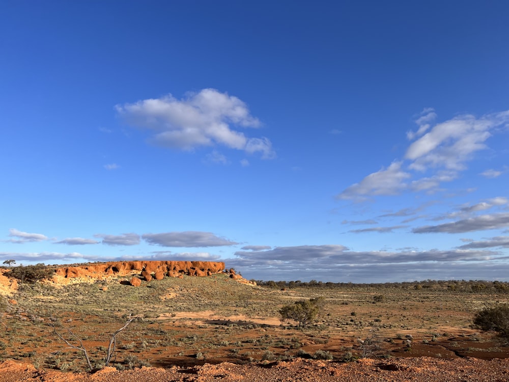 a desert landscape with a blue sky