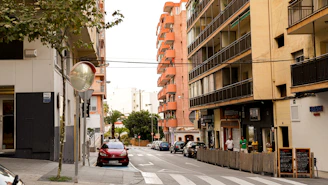 a street with cars and buildings on either side of it