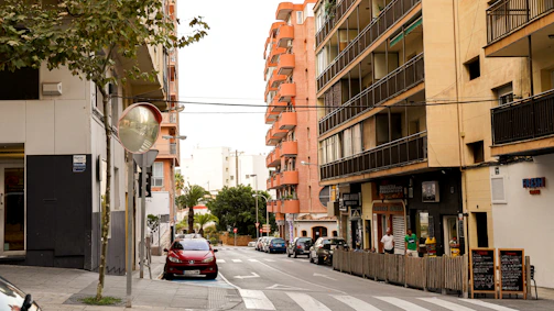 a street with cars and buildings on either side of it
