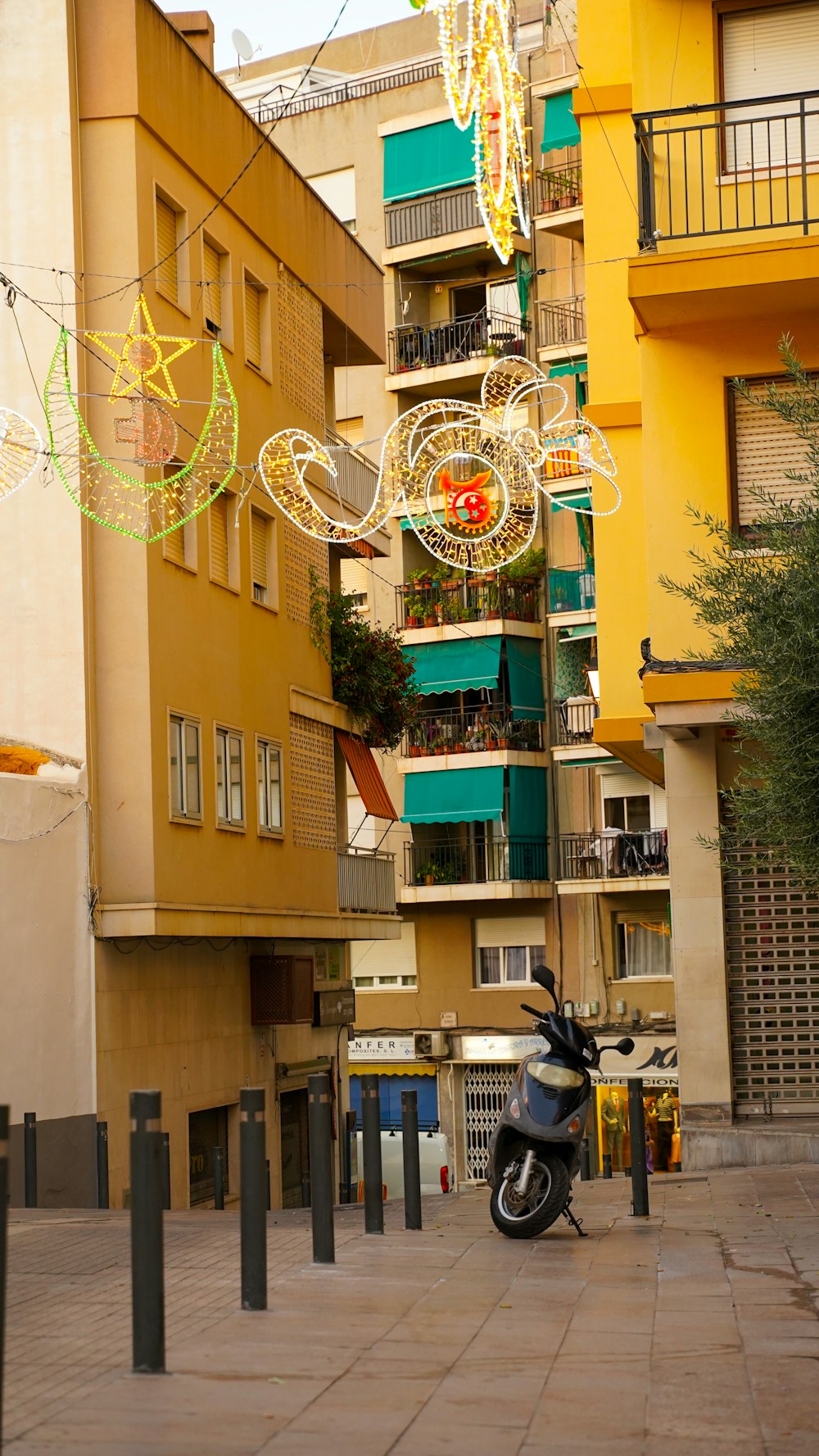 a motorcycle parked in front of a building with a large clock