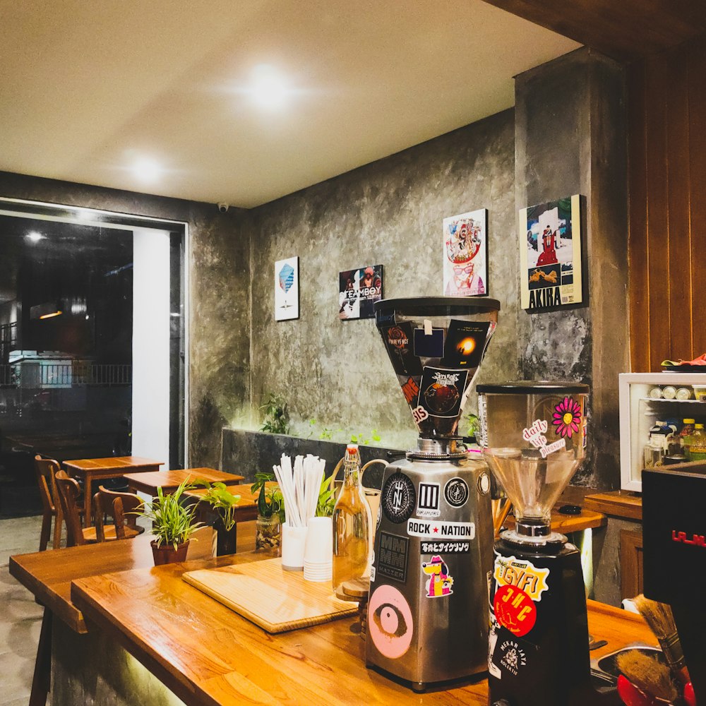 a table with a coffee maker and a coffee maker