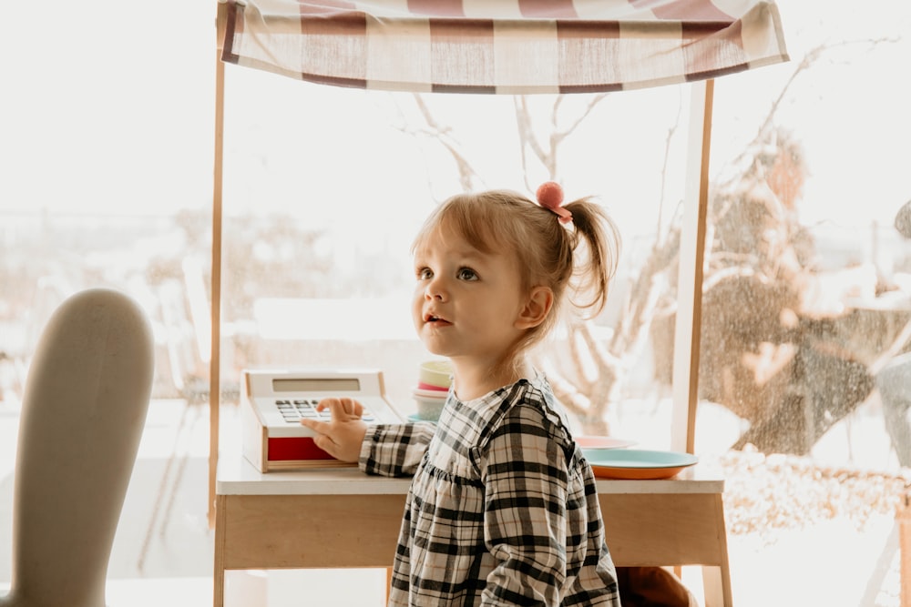 a little girl reading a book