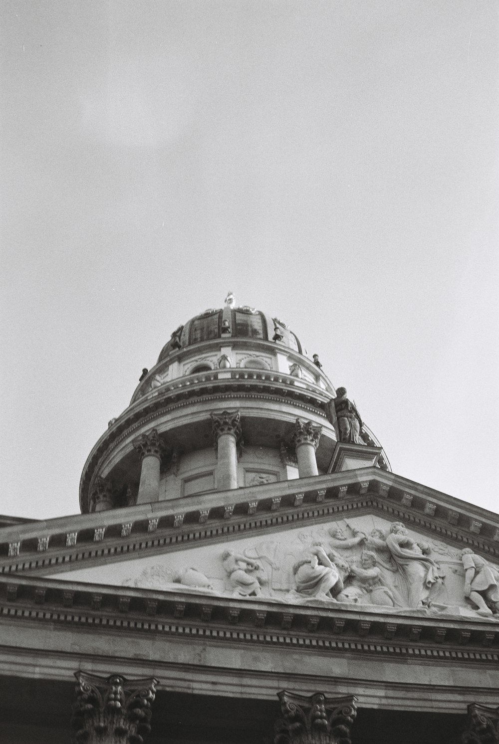 a building with statues on the roof