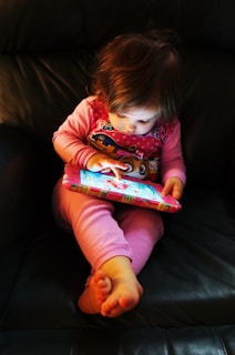 a baby lying on a couch